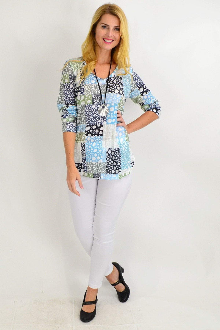 Spot-print Bubble Bath V-neck Tunic Top by Cafe Latte, featuring a relaxed fit and long sleeves, worn by a model.