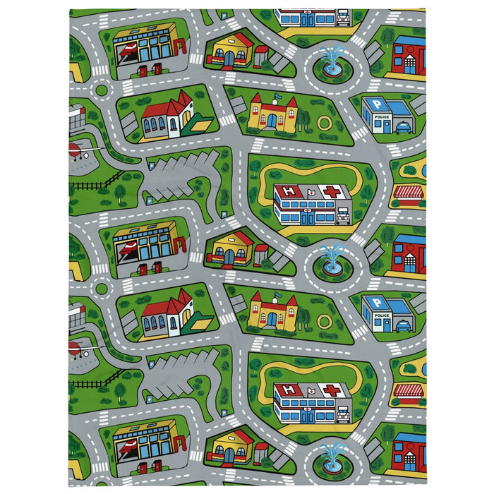 Car Carpet City Plush Blanket - The continuous loop of slate asphalt grey (#708090) roundabouts and intersections cutting through the expansive manicured lawn green (#4CA64C) fields.