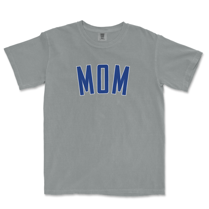 Gray Comfort Colors T-shirt with "MOM" printed in bold blue letters on the front, designed for Chicago baseball moms.