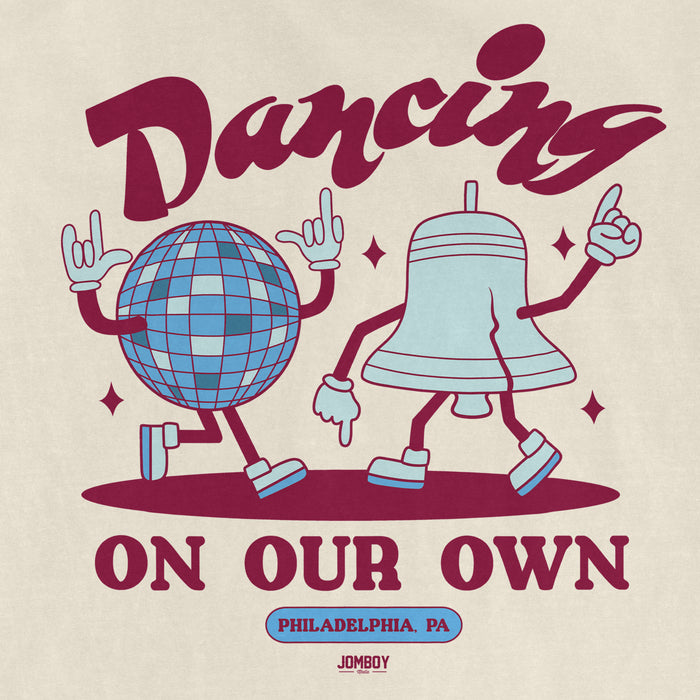 Comfort Colors tee featuring dancing cartoon characters of a disco ball and a bell, with "Dancing on Our Own" and "Philadelphia, PA" text.