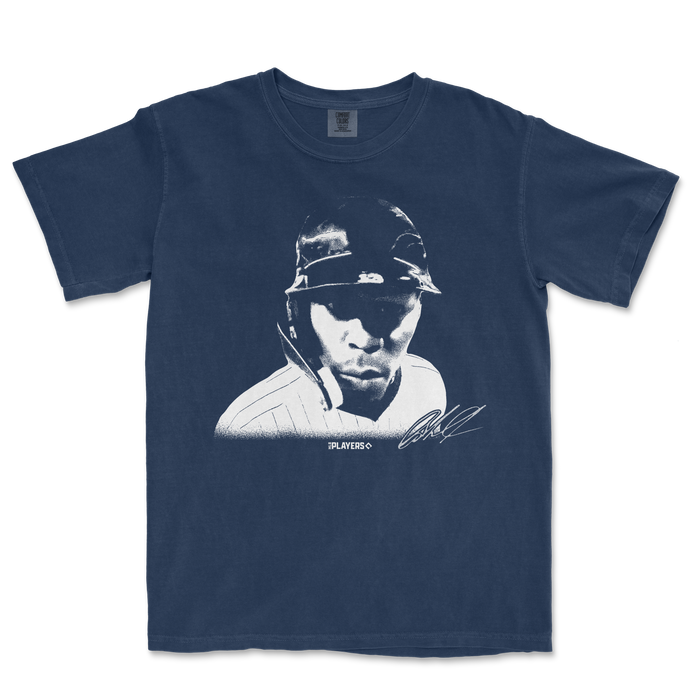 Comfort Colors navy T-shirt featuring a stylized graphic of Jazz Chisholm wearing a helmet, with "HUH?" text and autograph.