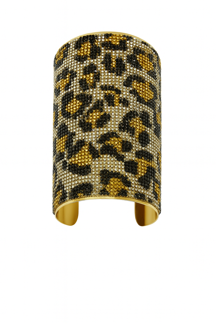 Wide gold-tone cuff bracelet with sparkling crystal leopard print embellishment.