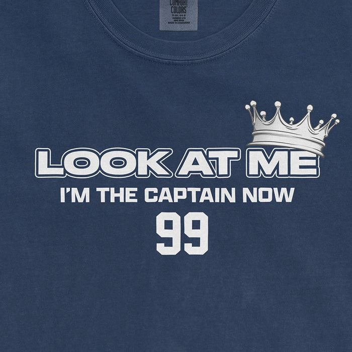 Blue Comfort Colors T-shirt with white text saying "LOOK AT ME I'M THE CAPTAIN NOW" and the number 99, featuring a crown graphic.