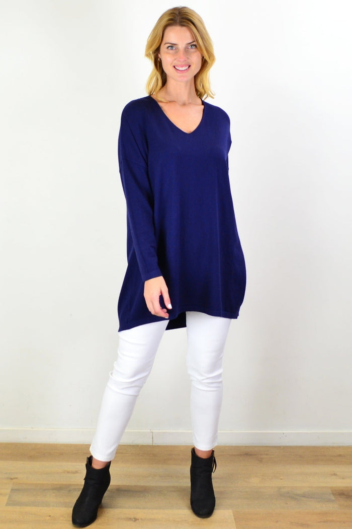 Navy blue wool blend fine knit tunic top by Cali&Co, close-up of the textured fabric and relaxed fit design.