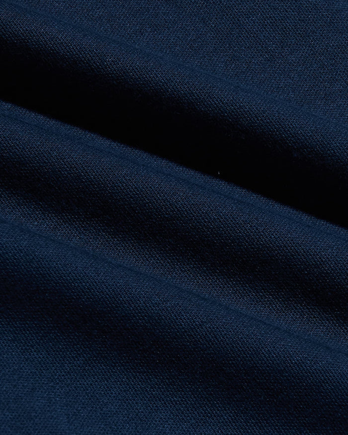 Close-up of smooth navy fabric texture showcasing the soft, durable material used in the Navy Tall Pima Cotton Blend Crew, a men's basics essential.