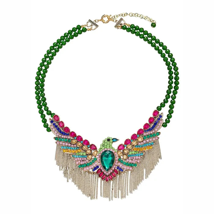 Phoenix brooch statement necklace with a multicolor rhinestone bird pendant, green double beaded strands, and a dramatic fringe drop.