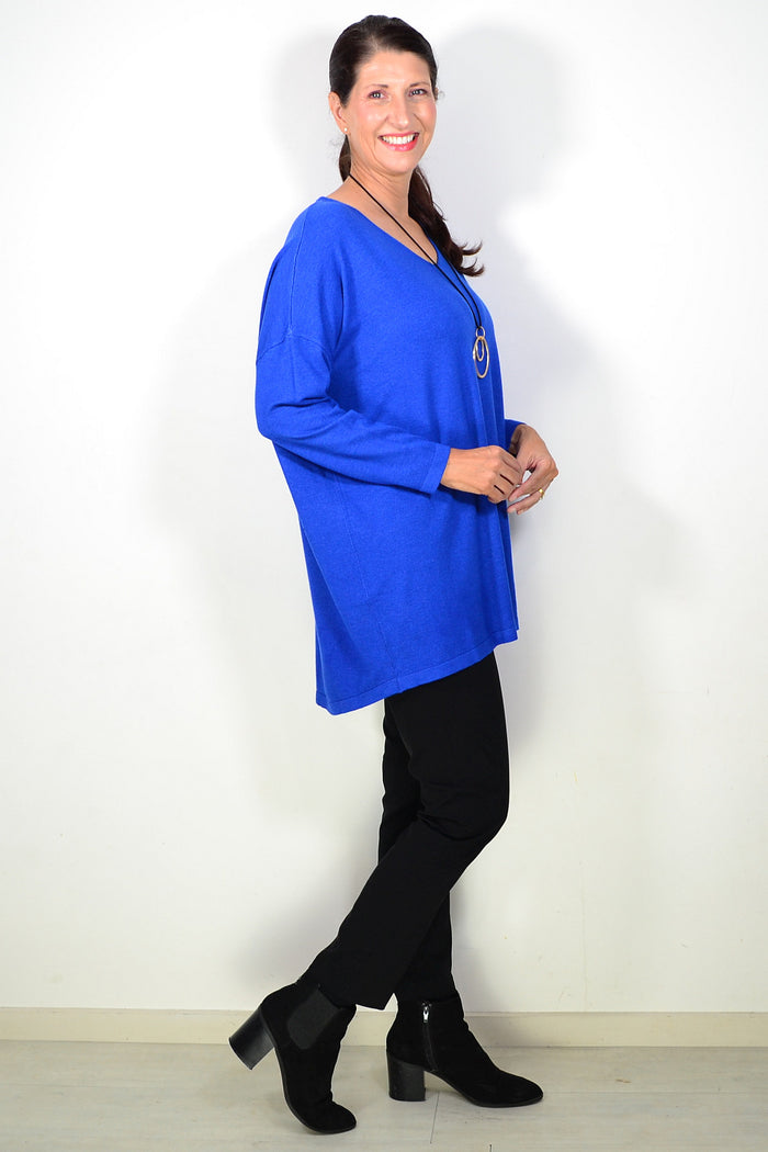 Royal blue wool blend fine knit tunic top from Cali&Co, showcasing its soft texture and classic fit on a hanger.