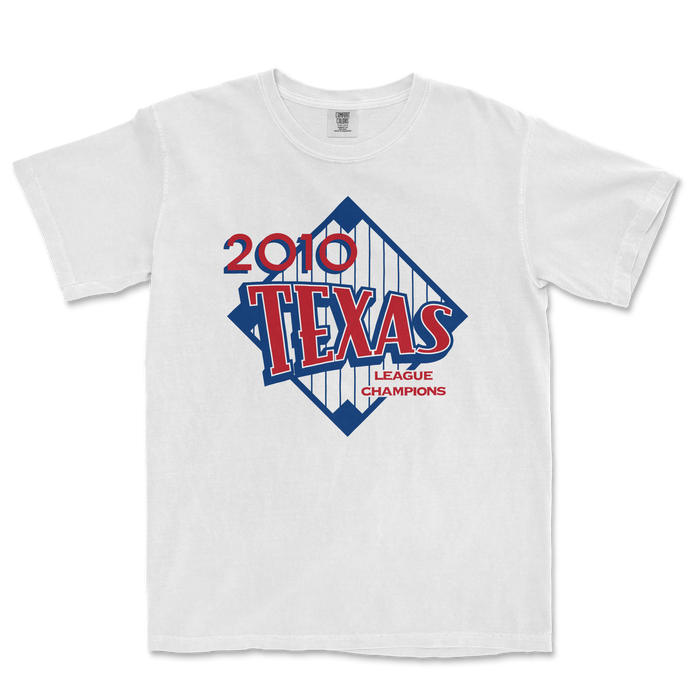 White T-shirt featuring a vintage-style graphic design celebrating the 2010 Texas League Champions, with bold red and blue text and graphics.