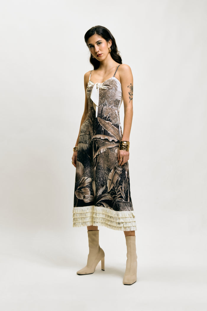 Afterlight Dress with botanical print, layered fringe hem, beige boots, and gold jewelry