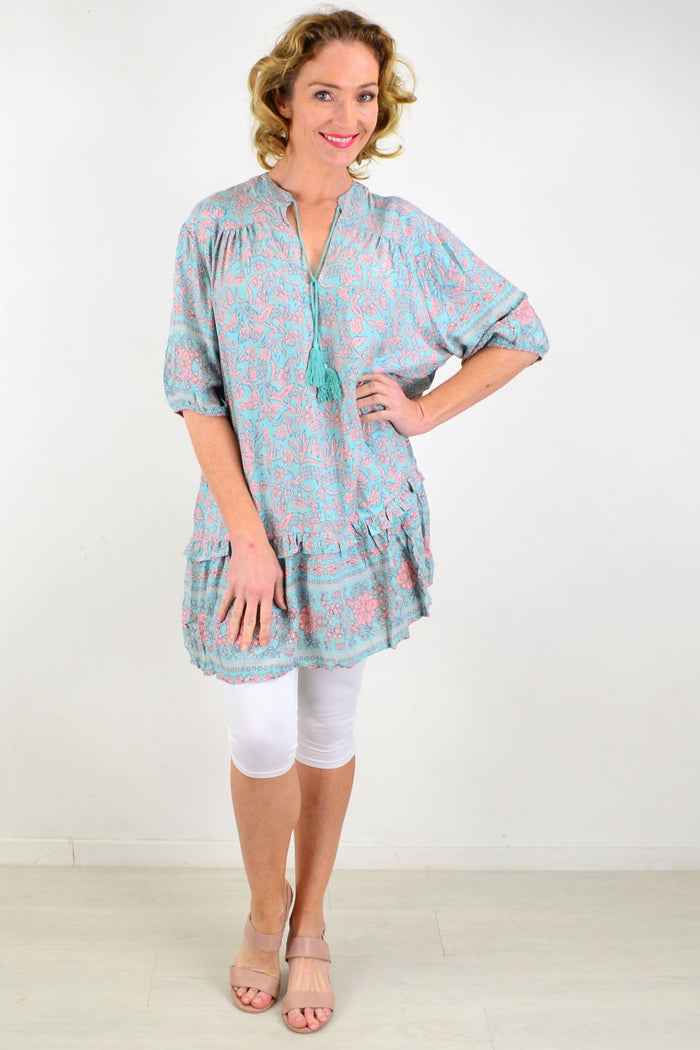 Aqua Bell Ruffle Tunic Top by Style Fashion featuring ruffled sleeves and flowy fabric in a vibrant aqua color.