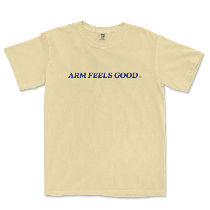 Cream-colored Comfort Colors tee with "ARM FEELS GOOD" printed in bold navy blue text across the front.
