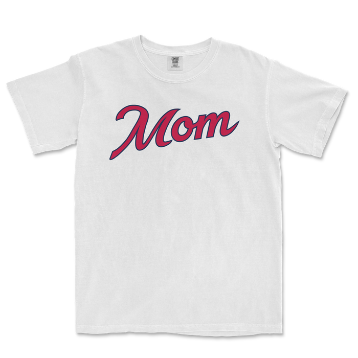 White Comfort Colors T-shirt with "Mom" written in large, cursive pink and navy font, designed for Atlanta baseball moms.