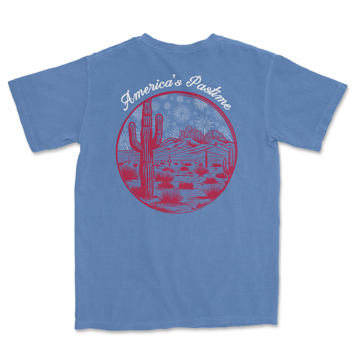 Blue t-shirt featuring a graphic of a desert landscape with cacti and mountains, labeled "America's Pastime.