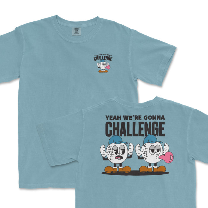 Light blue t-shirt featuring playful cartoon characters with the phrase "Yeah we're gonna challenge" on the back.