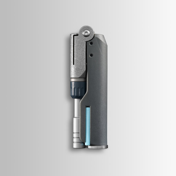 Batch #009: Adapter shown folded, with metallic and dark gray components and a slim cylindrical insert