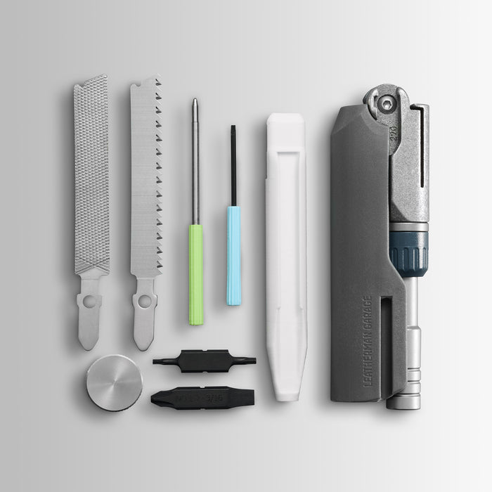 Batch #009: Adapter multitool components laid out, including files, saw, drivers, bits, and main tool body