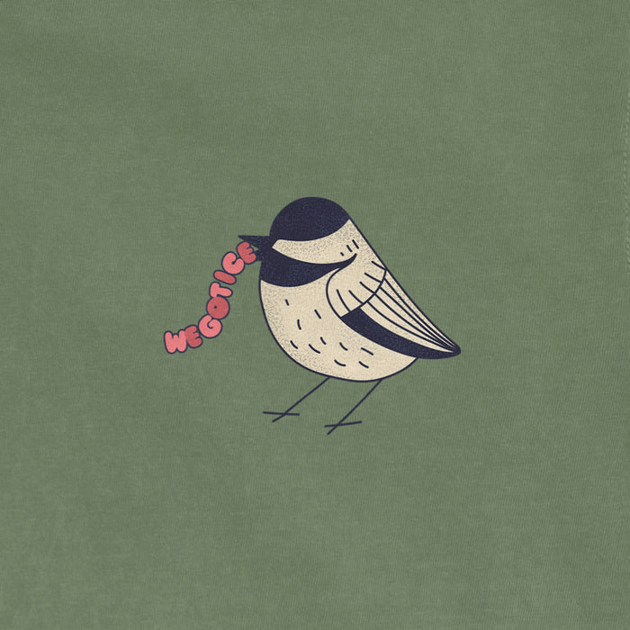 A vintage Comfort Colors T-shirt features a cute bird illustration with the words "We Got Ice" in pink text.