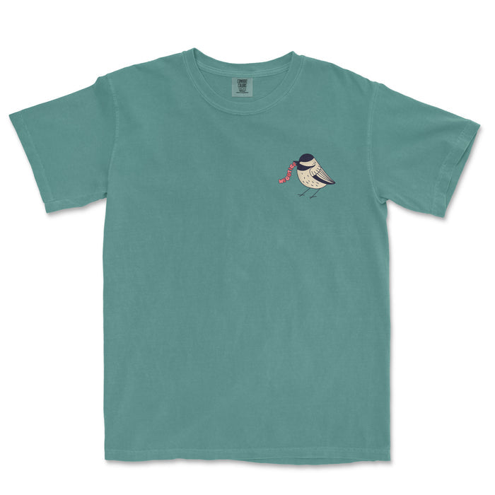 Vintage teal Comfort Colors® t-shirt featuring a small bird illustration with "Worms" written next to its beak on the chest.
