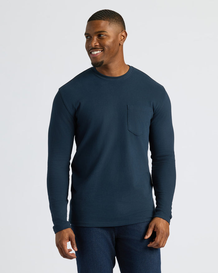 Young man in navy Black & Navy Tall Heavyweight Long Sleeve Pocket Crew.