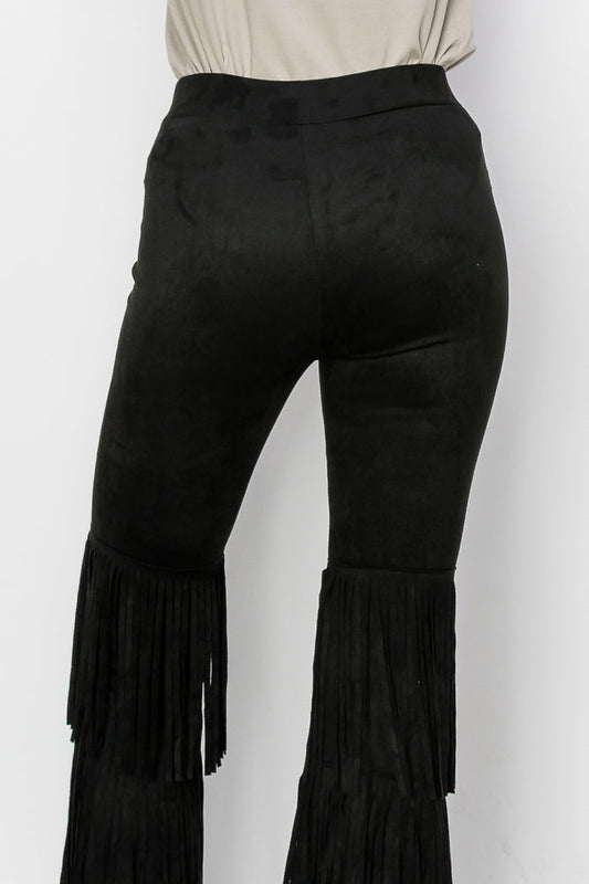 Black high-waisted flare pants with cascading tiered fringe from mid-thigh to hem.
