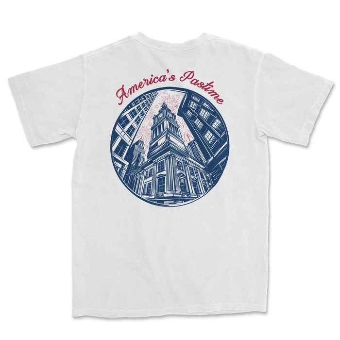 White t-shirt featuring a graphic of a historic building with "America's Pastime" text in a circular design.