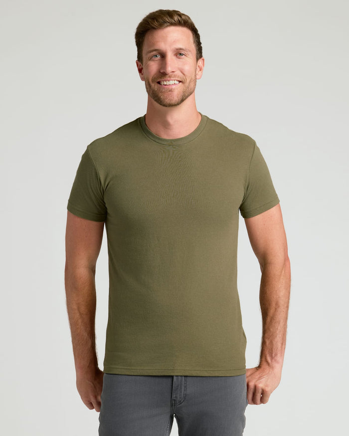 Man wearing Classic Crew Neck T-shirt from 6-Pack set, smiling.