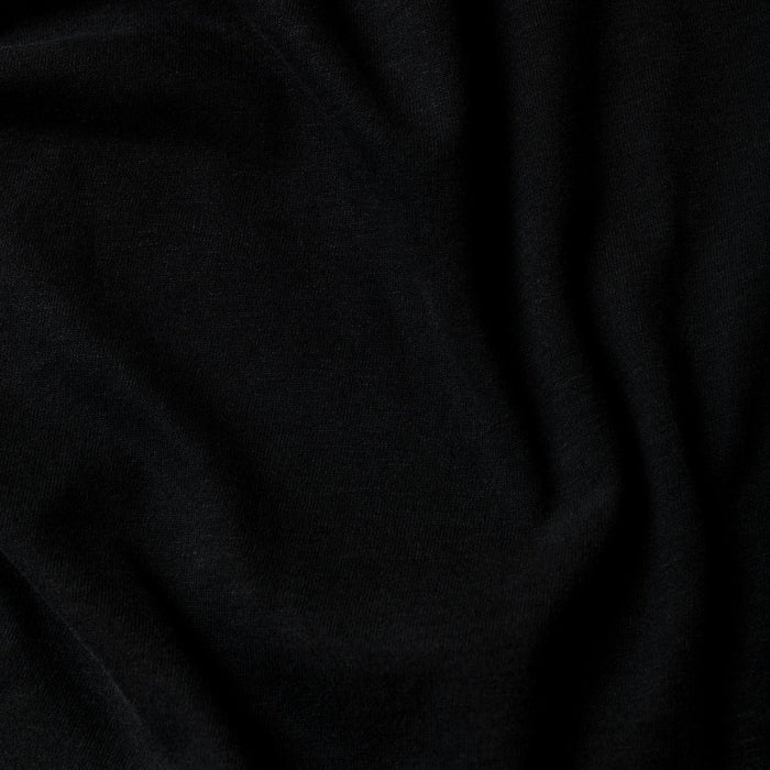 Black Classic Polo 6-Pack with soft fabric folds and three-button placket.