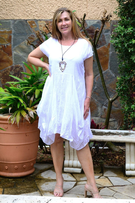 White cotton Sophia tunic dress by Wishstone, featuring a relaxed fit with long sleeves and a round neckline.