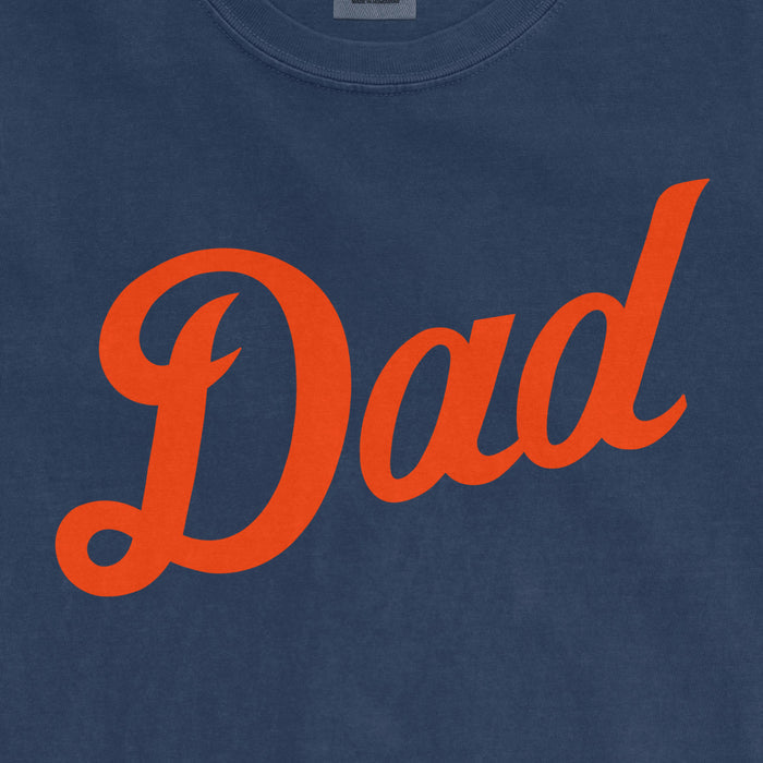 Blue Comfort Colors T-shirt with "Dad" written in large, orange cursive font, celebrating Detroit baseball dads.
