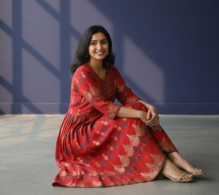 Kurti Connection USA red Anarkali kurti with gold and navy blue prints, detailed yoke, and flowing flare.