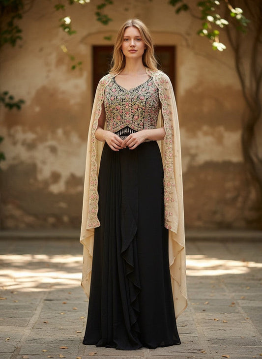 Kurti Connection USA black ethnic gown with floral embroidered bodice and sheer neutral cape worn by a blonde model