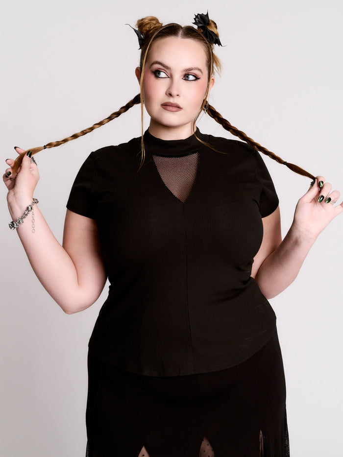 A black short-sleeve mock neck top with a fishnet mesh chest panel.