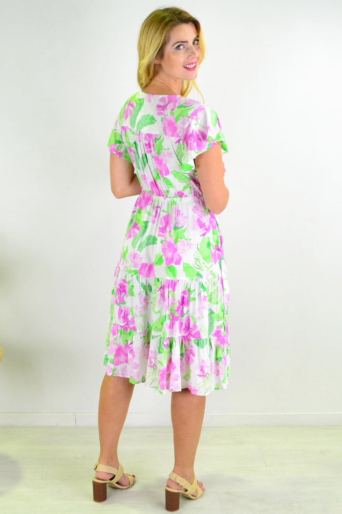 Floral tiered tunic dress from New U Collection showing a lightweight, flowy fabric with a tiered design and floral pattern.