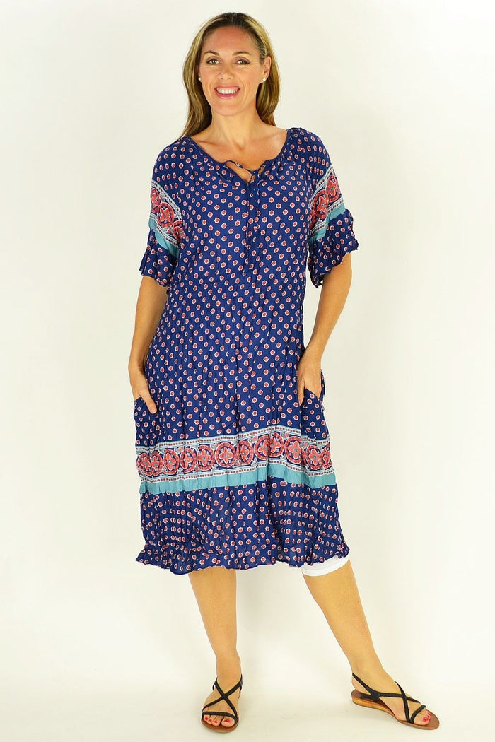 Flower in the Meadow Tunic Dress by Cafe Latte featuring a floral pattern and lightweight fabric, displayed on a hanger.