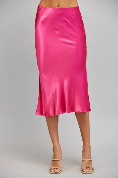 Fuchsia satin midi slip skirt with a smooth straight silhouette and clean hem.