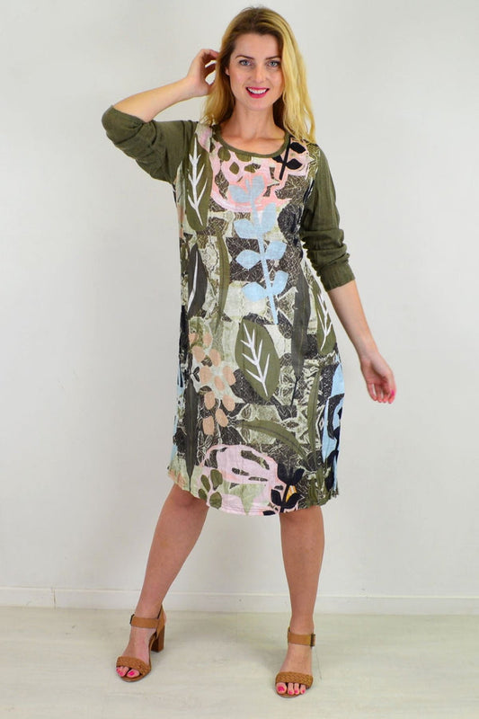 Cafe Latte Garden Paradise Crinkle Tunic Dress displayed on a hanger with floral patterns and lightweight, flowy fabric.