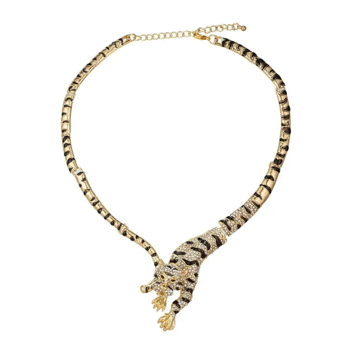 Gold crystal leopard statement necklace with black enamel accents and a sculpted animal motif design.