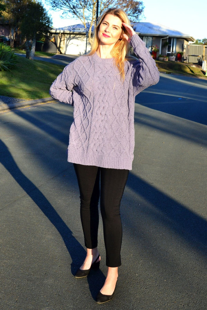 Cafe Latte grape chain stitch knit tunic jumper hanging on a display with detailed stitching and soft fabric texture.
