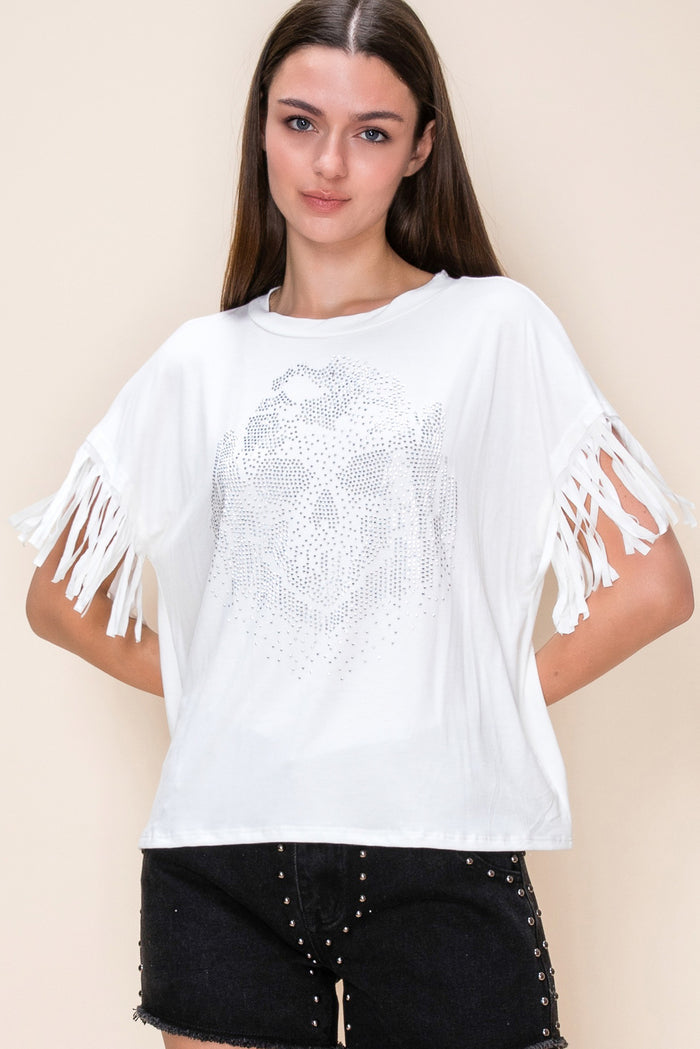 Ivory women's graphic tee with a sparkling crystal skull design on the front and fringe detail on the short sleeves.