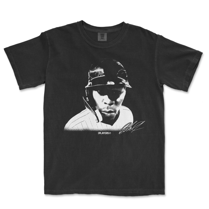 Black Comfort Colors T-shirt featuring a monochrome graphic of Jazz Chisholm wearing a helmet, with "HUH?" text and signature.