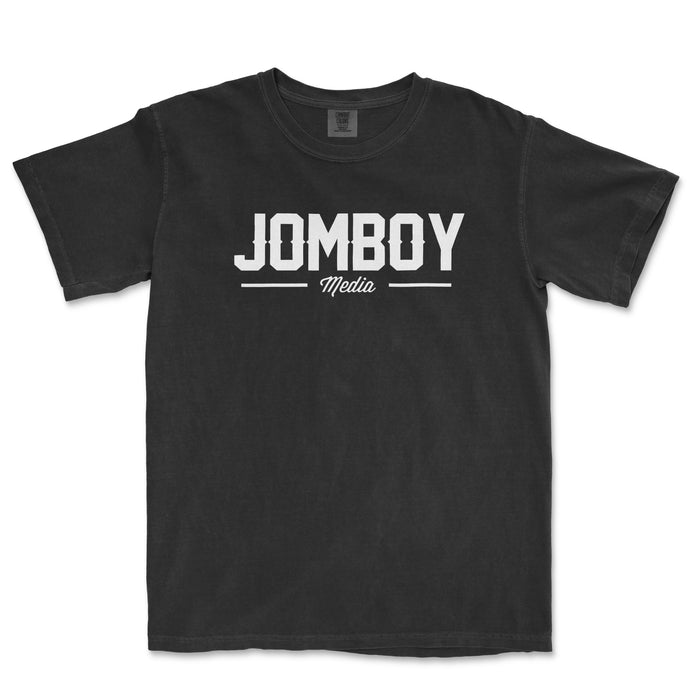 Black Comfort Colors T-shirt with "Jomboy Media" logo in white and gray text on the front.