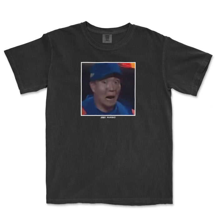 Black Comfort Colors T-shirt featuring a surprised expression of Kodai Senga, with a pixelated photo and small text below.