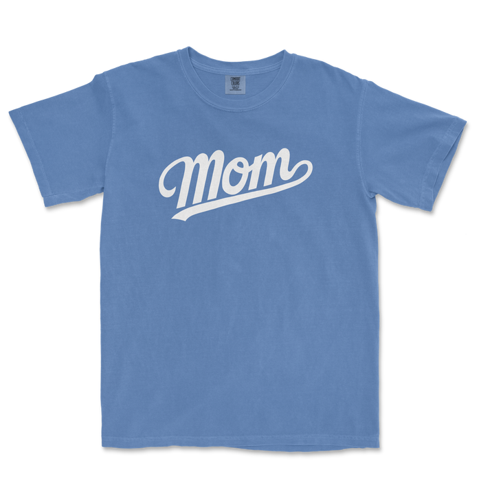 Blue Comfort Colors tee with white "Mom" text in a cursive font, perfect for a proud baseball mom.