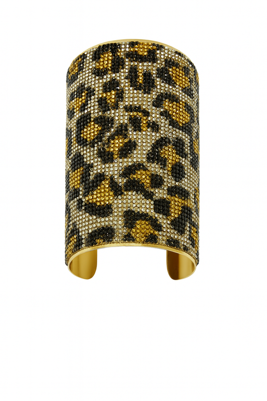 Wide gold-tone cuff bracelet with sparkling crystal leopard print embellishment.