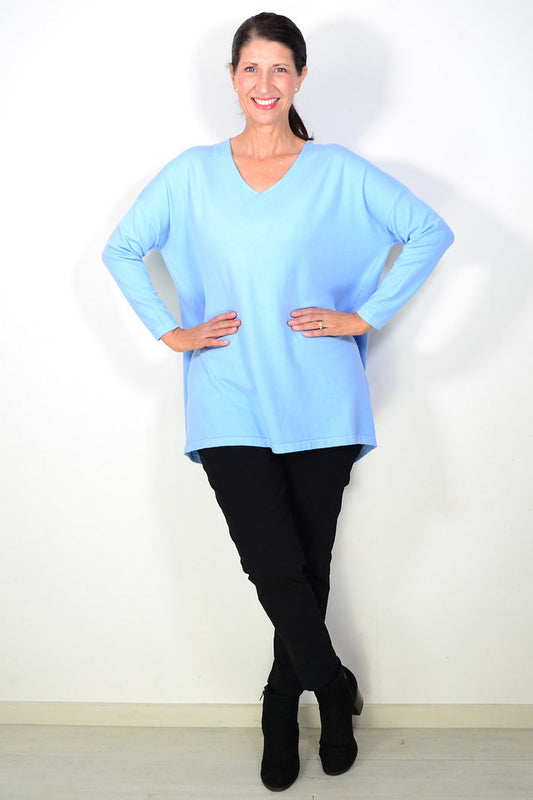 Light blue wool blend fine knit tunic top by Cali&Co, close-up of the textured fabric and relaxed fit.
