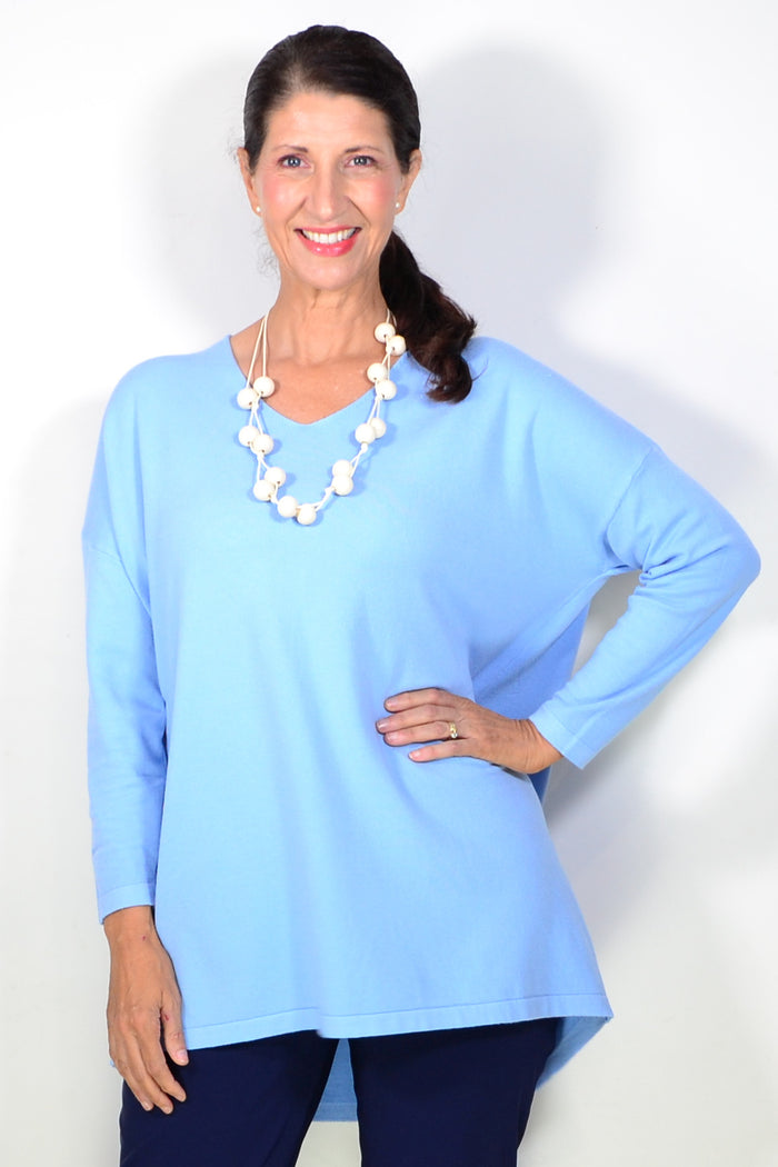 Light blue wool blend fine knit tunic top by Cali&Co, showcasing a close-up of the textured fabric and relaxed fit design.