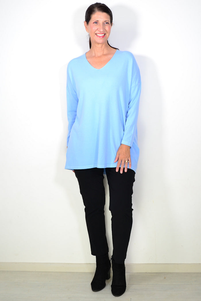 Light blue wool blend fine knit tunic top by Cali&Co, shown on a hanger with a close-up of the soft, textured fabric.
