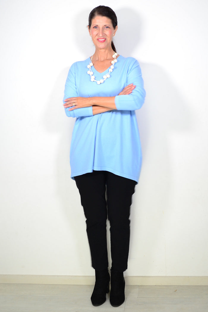 Light blue wool blend fine knit tunic top by Cali&Co, featuring a relaxed fit and soft texture, displayed on a hanger.