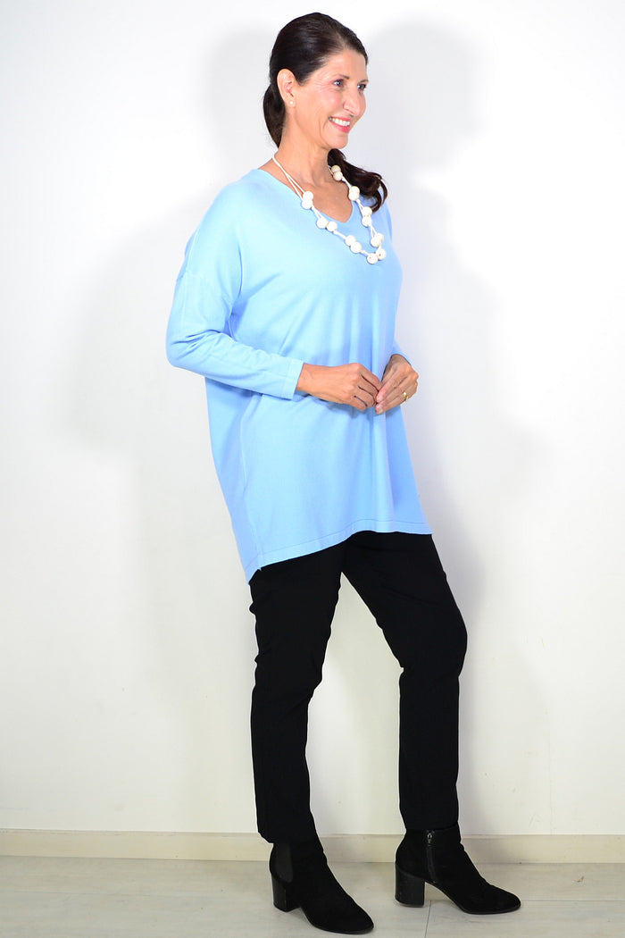 Light blue wool blend fine knit tunic top by Cali&Co, featuring a cozy, fitted design with long sleeves and a round neckline.