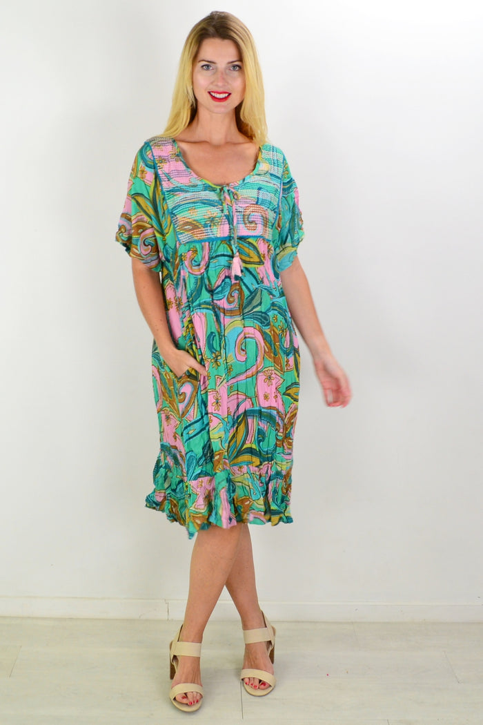 Orientique Mennagio Boho Bib Dress Tunic displayed with flowing fabric and bohemian style, featuring intricate patterns and a relaxed fit.